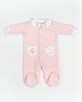 Pink baby onesie with floral details on a white background
